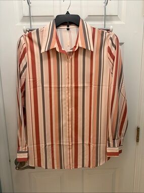 Women’s NWT blouse. Very pretty with stripes.